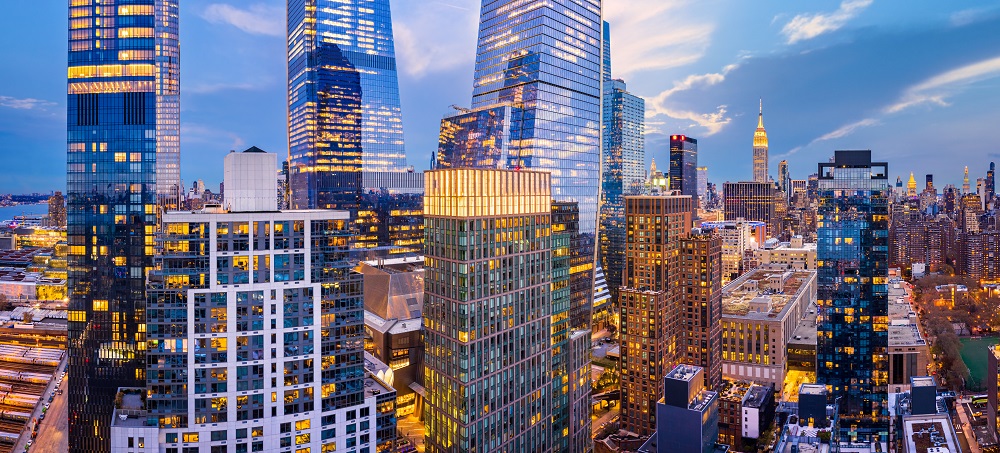 Aerial panorama of New York City skyscrapers at dusk as seen from above the 29th street, close to Hudson Yards and Chelsea neighborhood